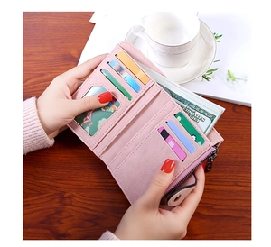 Detail view of pink PU leather wallet interior with card slots and a photo window