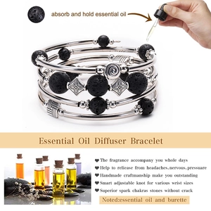 Detail view of volcanic lava stone diffuser bracelet absorbing essential oils on the beads