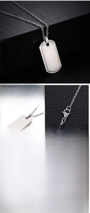 Close-up of S.STEEL engraving on a polished stainless steel military dog tag pendant