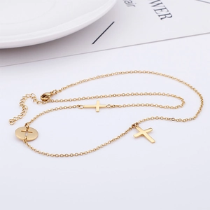 Minimalist gold titanium steel necklace with triple cross pendants and a round hollow disk