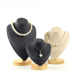 Three-piece set of wooden neck busts with velvet padding for jewelry necklace display