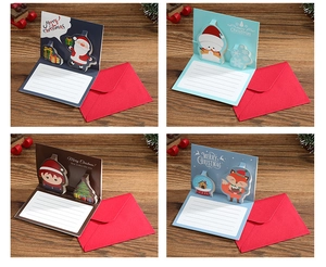 Set of four 3D pop-up Christmas greeting cards with festive designs and red envelopes