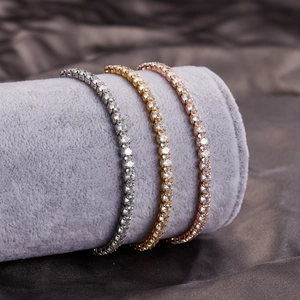 Macro detail of gold, silver and rose gold tennis bracelets with 3mm cubic zirconia