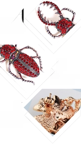Détail de broche scarabée rouge de luxe montrant le fermoir et l'incrustation de zircon