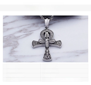 Detailed engraving on stainless steel Egyptian Ankh pendant with scarab and wing motifs