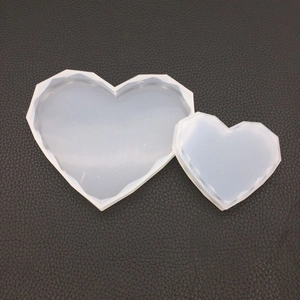 Macro detail of heart-shaped diamond cut silicone molds for DIY resin and candle making