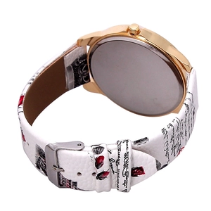 Close-up of white leather watch band with red roses and elegant cursive patterns