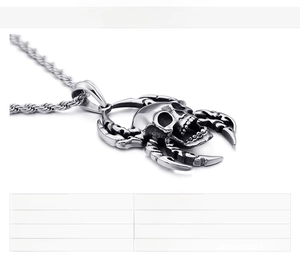 Macro shot of punk style stainless steel spider skull pendant with size specifications