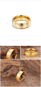 Detailed macro view of a gold tungsten steel ring with polished mirror finish and grooves