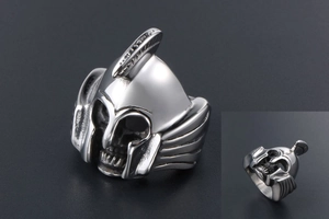 Detailed macro shot of vintage silver Spartan helmet steel ring with skull mask details