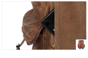 Detail of vintage canvas backpack side pocket showing smartphone storage capacity