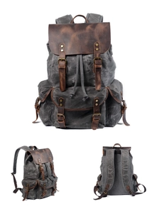Three-view layout of a vintage grey canvas and brown leather backpack with drawstring details