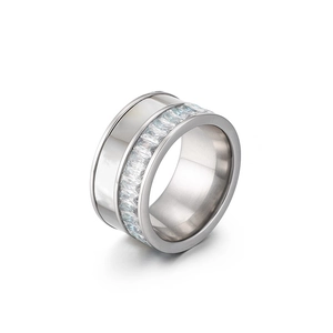 Silver wide band ring featuring rectangle clear zircons on a white background