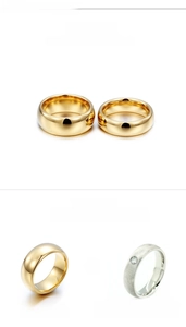 Macro detail of hand-polished tungsten steel rings in gold and silver finish
