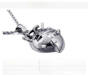 Mechanical style stainless steel heart pendant detailing material and 85g weight specs
