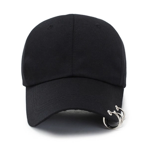 Minimalist black wool baseball cap featuring three silver metal rings on the brim