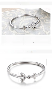 Detailed size specifications for stainless steel arrow bangle weighing 19g and 64x15mm