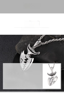 Macro detail of a 316L stainless steel shark tooth pendant with a twisted rope chain