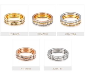 Multiple views showing double-row crystal-encrusted stainless steel rings in varied colors