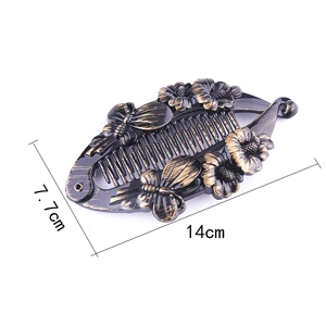 Detailed view of vintage black gold banana clip with dimensions 14cm by 7.7cm