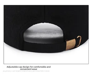 Adjustable metal buckle on black winter baseball cap with thick wool-like fabric texture
