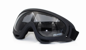 Detail view of polarized ski goggles with matte black frame and adjustable strap