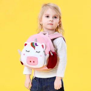Pink cartoon animal backpack for kids with fluffy unicorn face on bright yellow background