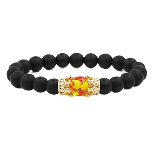 Matte black stone elastic crown bracelet with golden micro-set zircon and amber bead