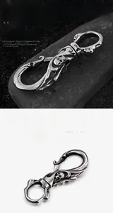 Close-up of gothic skull pendant on a stainless steel keychain with antique silver finish