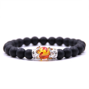 Matte black stone beaded crown bracelet with silver micro-pave zircon and orange accent