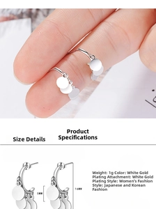 Macro shot showing 16mm silver tassel earrings with 5mm disc detail and size dimensions