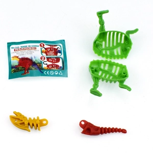 Flat lay of colorful DIY dinosaur skeleton assembly kit with instruction manual