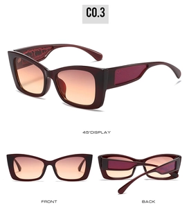 Cat eye sunglasses detail showing burgundy frames with red crocodile pattern temples