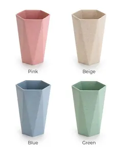 Detailed view of hexagonal toothbrushes cups in pink, beige, blue and green matte tones