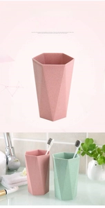 Close-up of pink and green geometric mouthwash cups with a hexagonal rim design