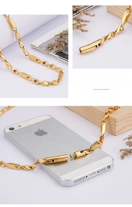 Detail of gold-plated stainless steel chain with geometric links and cylindrical clasp