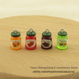 Close-up of four miniature resin fruit jam jars with metal loops and fruit labels