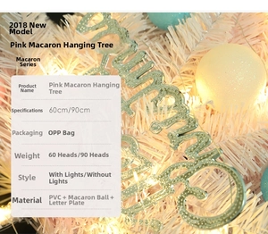 Detail showing pink macaron Christmas tree texture with festive ornaments and lights