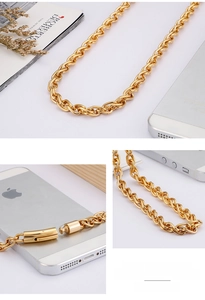 Detailed shot of heavy gold-plated steel chain with industrial cylindrical buckle