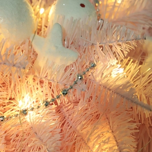 Pink PVC upside down Christmas tree with LED lights and white foam ornaments