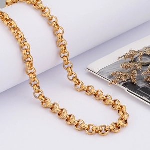 Retro golden stainless steel curb chain necklace with textured links on white background
