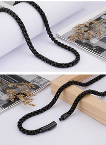 Detail of 6mm gold square pearl chain necklace with unique clasp closure and modern style