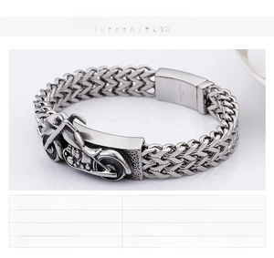 Detail view of heavy vintage biker bracelet in stainless steel with a motorcycle motif