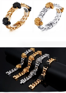Detail of hip hop cuban link bracelet with micropave lion head in black gold and steel finish