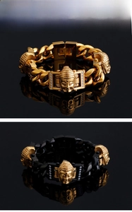 Detail of stainless steel men's bracelets with gold buddha head and crystal accents