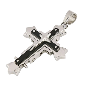 Detailed macro of a silver stainless steel cross pendant with black inlay and rivet accents