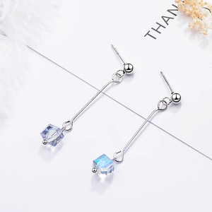Long crystal drop earrings featuring blue cube pendants and elegant silver chains
