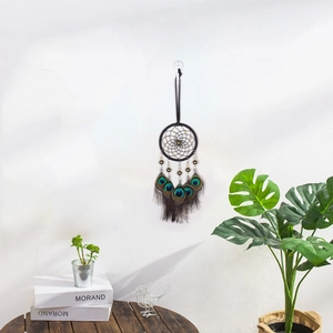 Handmade dream catcher with peacock feathers and black beads for car or home wall decor