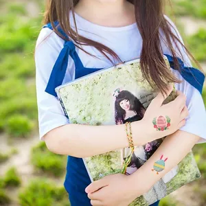 Waterproof Easter temporary tattoos featuring colorful bunnies and eggs on arm