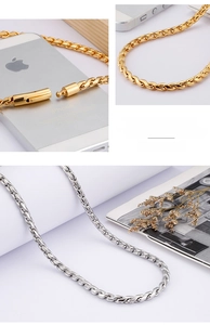 Macro detail of fine steel curb chain necklace with secure cylindrical mechanical clasp